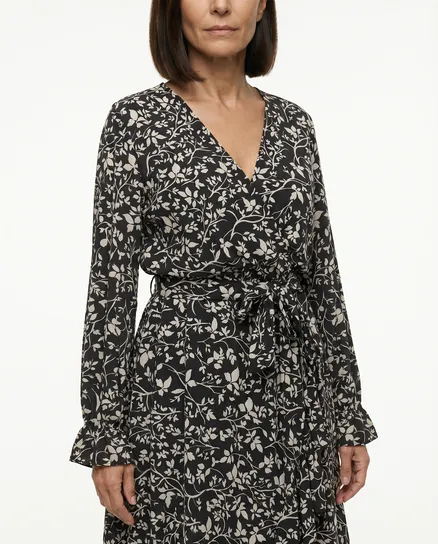 Kleid Wickeloptik in schwarz von Made in Italy